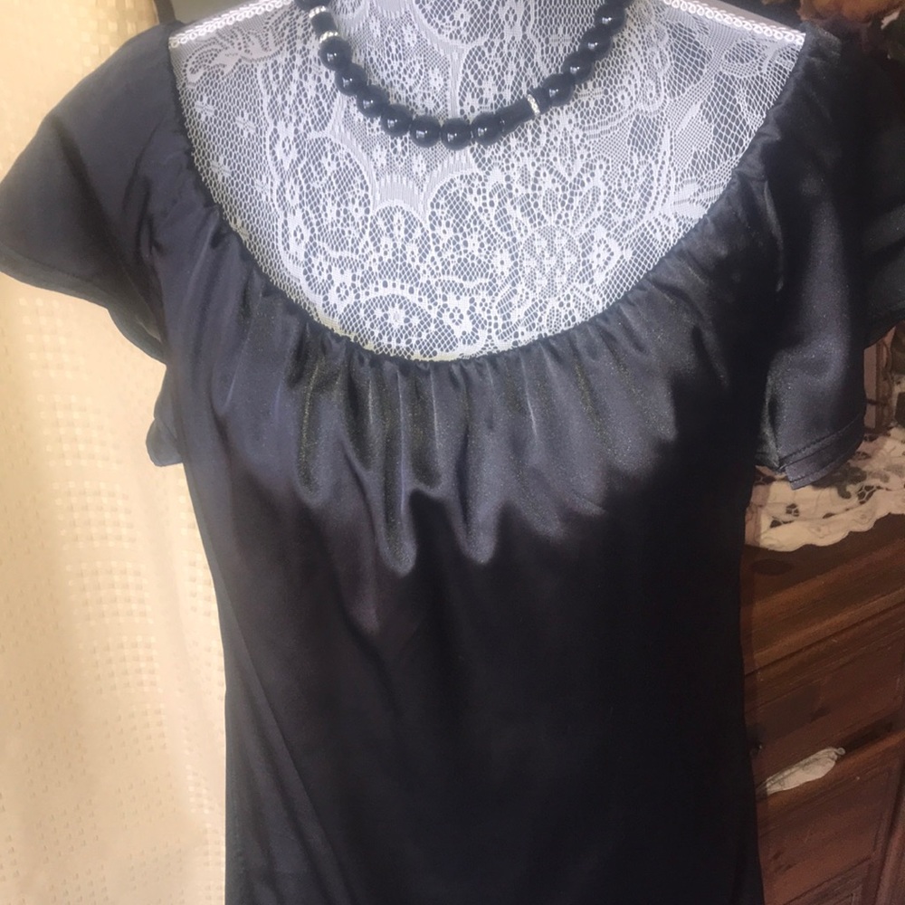 Bebe black evening dress.Satin lined elast neck